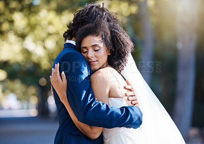 Buy stock photo Care, hug and wedding bride with groom at romantic outdoor marriage event celebration together. Partnership, commitment and trust embrace of married interracial couple in nature with bokeh.