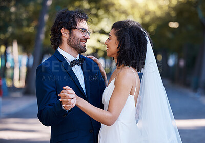 Buy stock photo Interracial wedding, couple and dancing in street with excited smile, happiness or future. Black woman bride, man and diversity at outdoor marriage for love, dance or eye contact in sunshine by trees