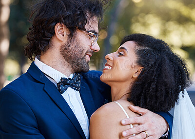 Buy stock photo Happy couple, love and wedding celebration event together with commitment, care and support. Interracial man and woman at park with trust, marriage partnership and a hug with a smile on their face