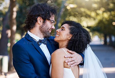 Buy stock photo Marriage, happy couple and wedding celebration event outdoor for love, care and commitment. Interracial man and woman married at a park with trust, partnership and a hug  while together for support
