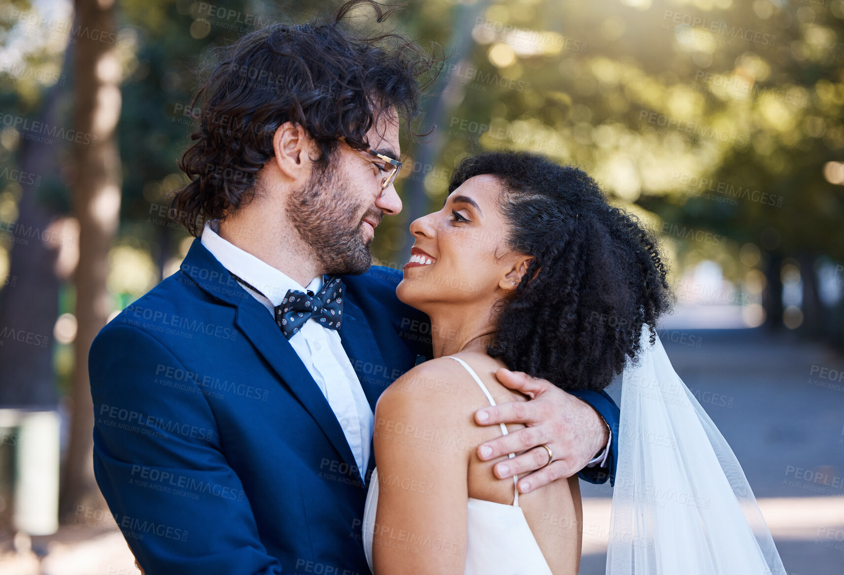 Buy stock photo Marriage, happy couple and wedding celebration event outdoor for love, care and commitment. Interracial man and woman married at a park with trust, partnership and a hug  while together for support