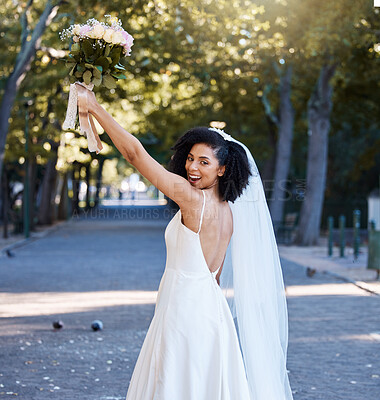 Buy stock photo Bride, wedding and black woman with flowers at park outdoors. Portrait, marriage or beauty of happy female holding up floral bouquet of roses to celebrate at party, ceremony event or love celebration