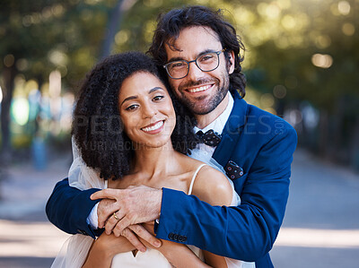 Buy stock photo Happy, couple portrait and outdoor for wedding celebration event with a hug for commitment. Interracial man and woman at park with trust, partnership and love in marriage with support and care