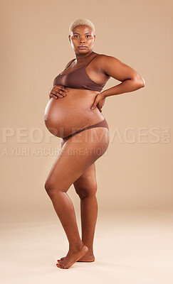 Buy stock photo Pregnant, body and black woman isolated on studio background for beauty, skincare and abdomen health. Underwear, stomach and african model or person with pregnancy for wellness, care and self love