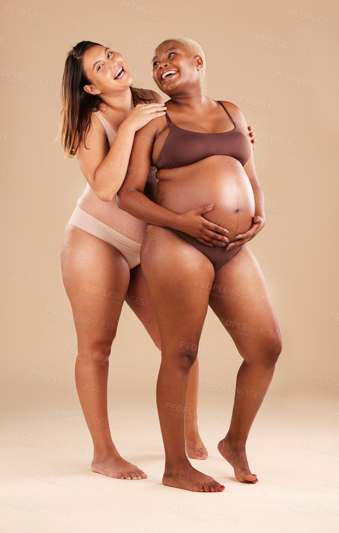 Buy stock photo Pregnant body, bonding or laughing women on studio background in health empowerment, baby support or community. Smile, happy and pregnancy friends in underwear in funny, comic or family planning joke