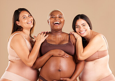 Buy stock photo Portrait, beauty and body with pregnant friends in studio on a beige background for diversity or motherhood. Family, love and pregnancy with a woman friend group showing their baby bump stomach