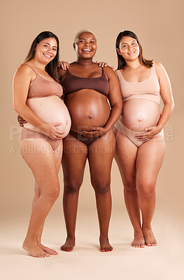 Buy stock photo Pregnant, body and portrait of women in stomach support touch, hope and community diversity on studio background. Smile, happy and pregnancy friends in underwear, belly growth and healthcare wellness