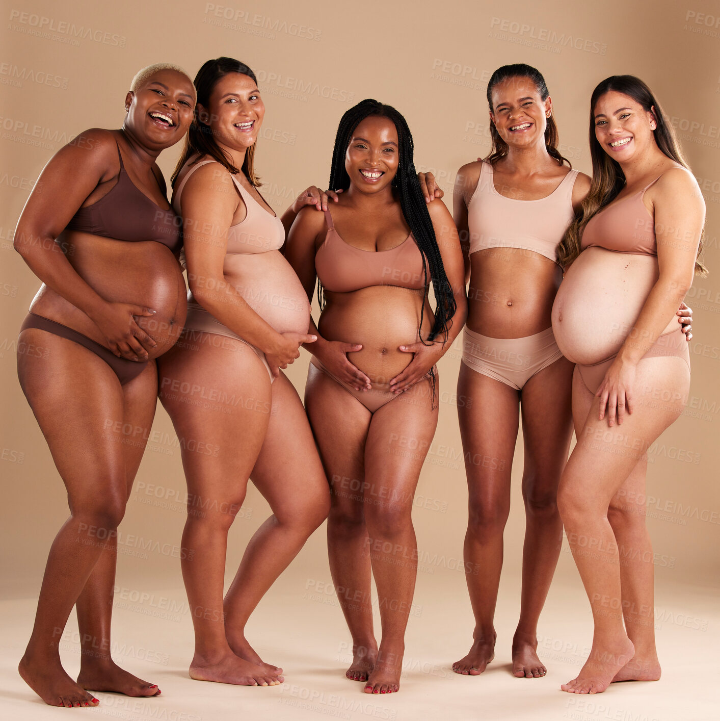 Buy stock photo Pregnancy, beauty and portrait of friends in a studio for diversity, motherhood and prenatal wellness. Maternity, love and pregnant women showing their baby bump stomach together by beige background.