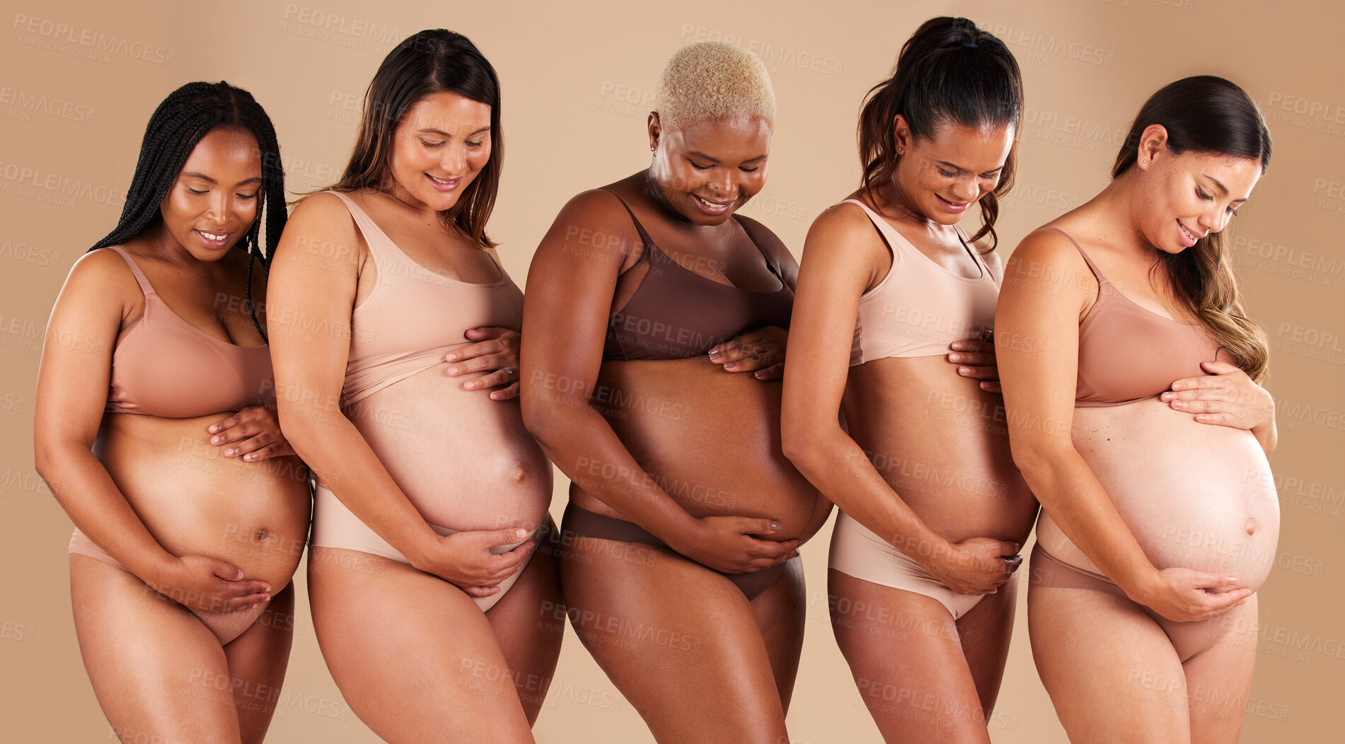 Buy stock photo Happy women, body or holding pregnancy stomach in support line, solidarity or community diversity on studio background. Pregnant, friends or mothers underwear for belly growth or healthcare wellness