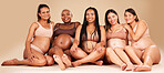 Portrait, group or pregnancy friends sitting in underwear in community bonding, diversity support or body empowerment. Happy smile, floor or pregnant women in healthcare wellness, future baby or love
