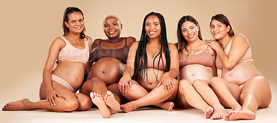 Buy stock photo Portrait, group or pregnancy friends sitting in underwear in community bonding, diversity support or body empowerment. Happy smile, floor or pregnant women in healthcare wellness, future baby or love