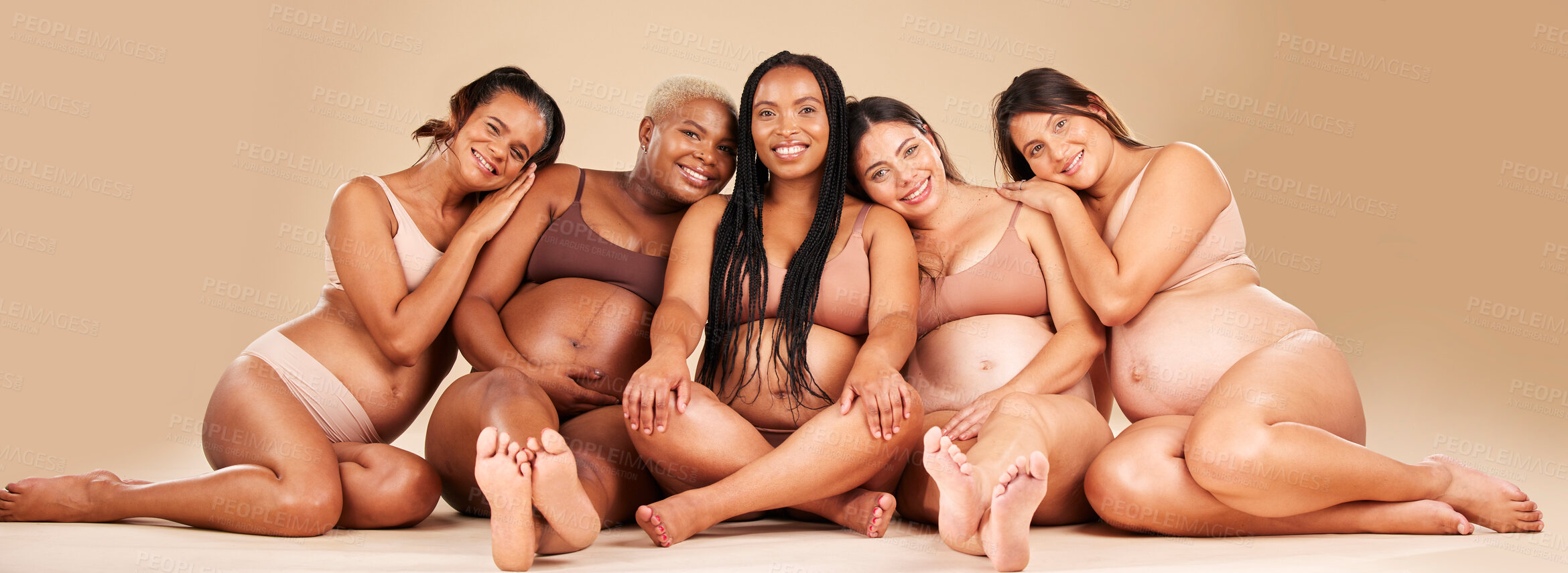 Buy stock photo Portrait, hug or sitting pregnancy friends in underwear for community bonding, diversity support or body empowerment. Happy smile, floor or pregnant women in healthcare wellness, future baby or love