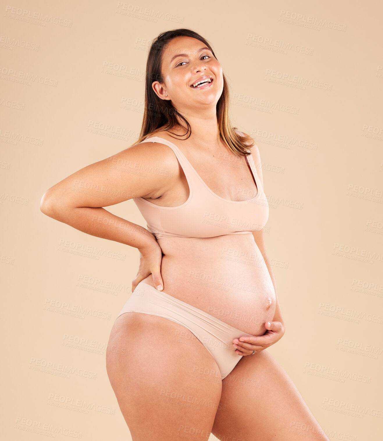 Buy stock photo Laughing, body or holding pregnancy stomach in underwear on studio background protection, woman love or baby support. Smile, happy or funny pregnant mother with belly or joke on mock up