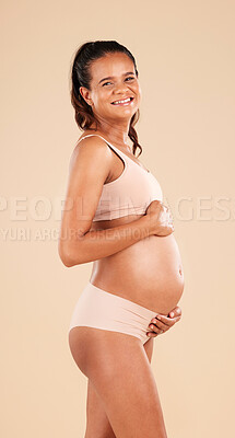 Buy stock photo Pregnancy portrait, lingerie or studio woman with smile, happy and excited for baby, stomach growth or motherhood. Gynecology care, maternity wellness or pregnant model with healthcare, love and hope