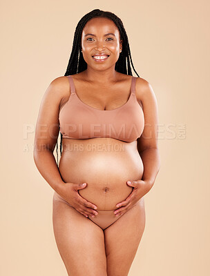 Buy stock photo Pregnancy portrait, care and underwear woman with smile, happy and excited for baby, stomach growth or motherhood. Feeling abdomen, maternity or pregnant studio model with healthcare, love and hope