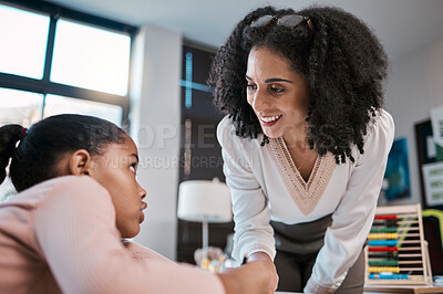 Buy stock photo Teaching, black woman teacher and child education, support and helping with learning development. Classroom, knowledge and school with person talking to girl at desk for language, writing or math
