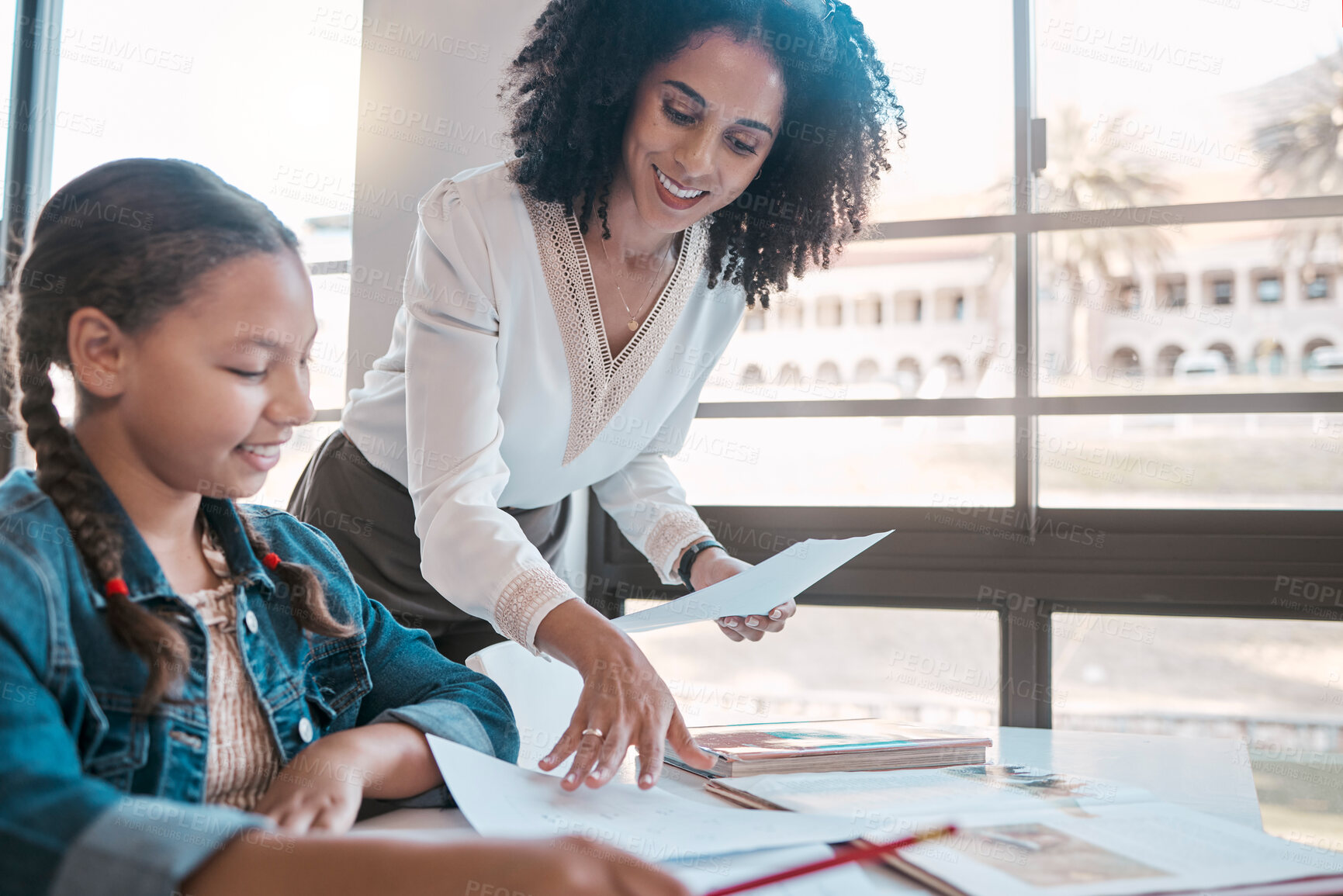 Buy stock photo Help, education or teacher teaching a student in a classroom with learning development or studying. Writing, papers or happy black woman helping, talking or speaking to a creative high school girl 