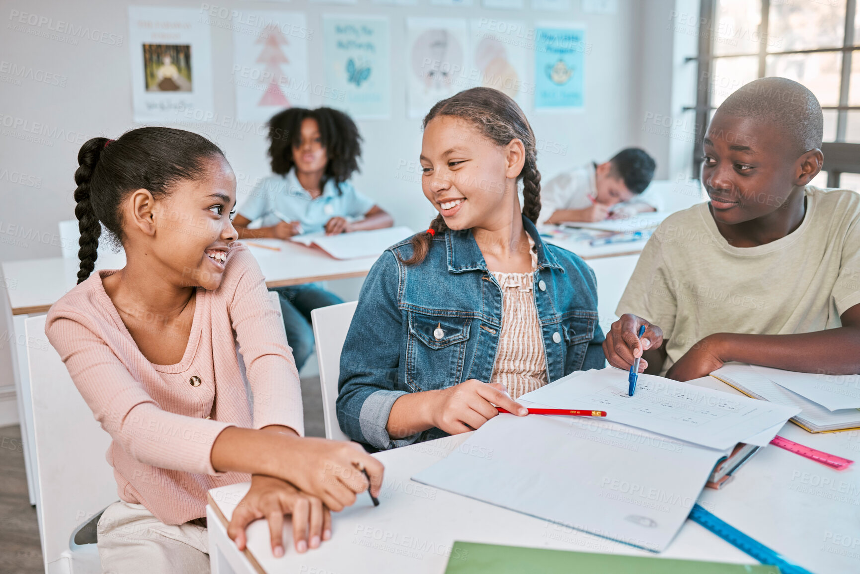 Buy stock photo Friends, education and children talking in classroom, working together on project in Montessori school. Books, help and group of students with math test question, brainstorming and thinking at desk.