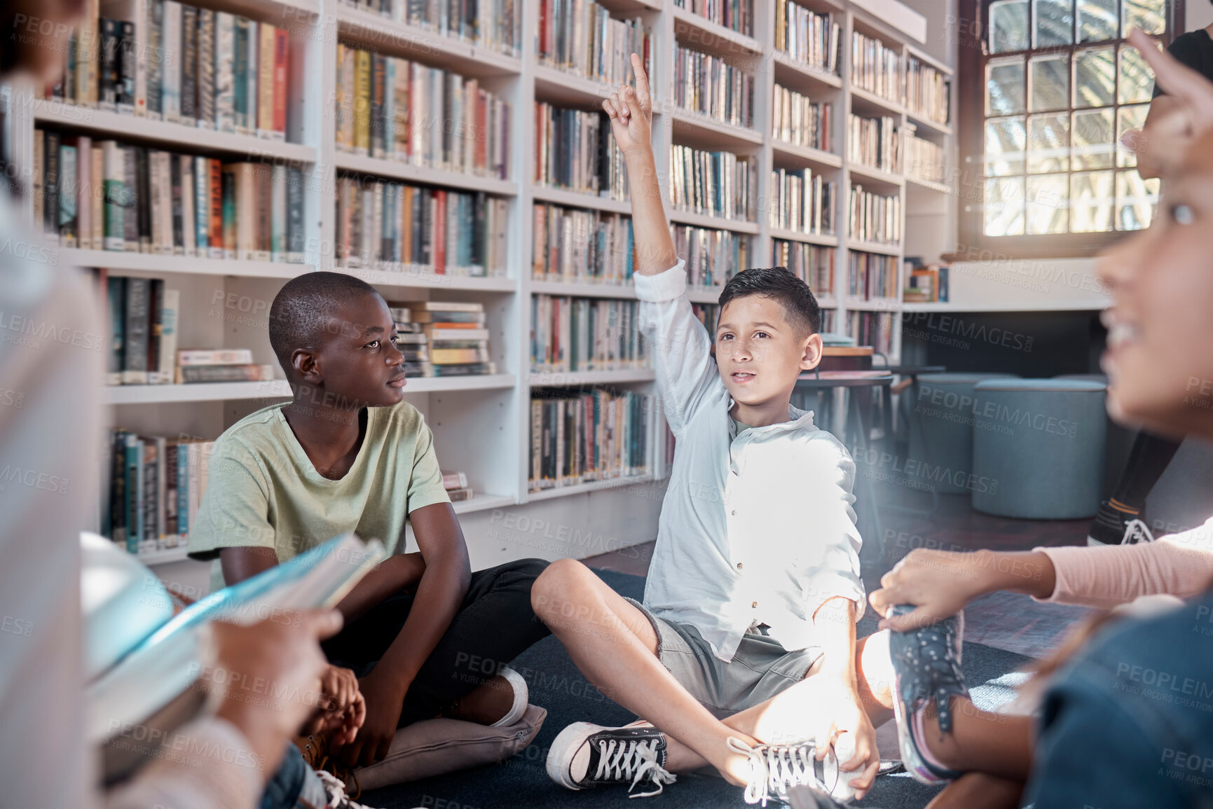 Buy stock photo Teacher, reading or student with questions in a classroom or library for learning development. Hands up, storytelling or children listening and smart kids asking for knowledge on fun books at school
