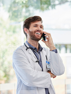 Buy stock photo Doctor, man and phone call with smile at hospital for conversation, news and networking by window. Happy medic, smartphone and medical discussion for advice, help or consulting for support at clinic