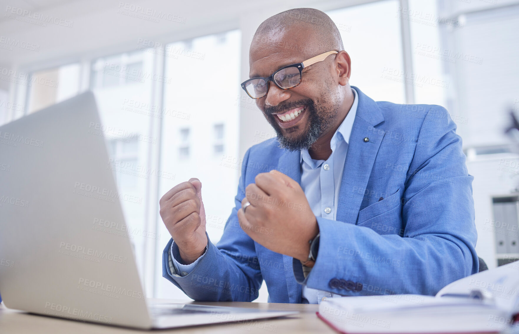 Buy stock photo Black man, laptop and fist celebration in office for web design success, happiness or winner achievement. African businessman, celebrate and happy hands for online communication on digital device 