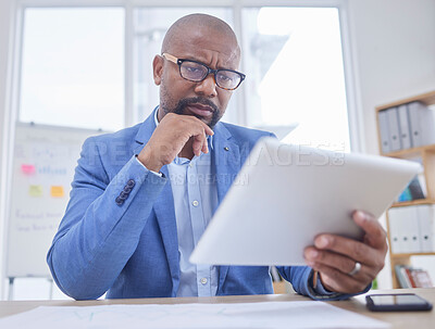 Buy stock photo Black man, tablet and serious thinking face in office for web design, online communication or reading tech email in office. African businessman, digital search or boss planning strategy on device 