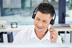 Call center, contact us and customer service worker consulting or working telemarketing in the office. CRM, help and happy male agent, consultant or employee smiling on a call using a headset