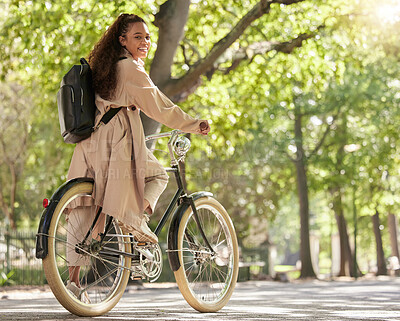 Buy stock photo Bicycle, bike and woman travel in a park outdoors in nature happy and excited on fun ride or commuting. Exercise, wellness and lifestyle female student cycling and relaxing on eco friendly traveling