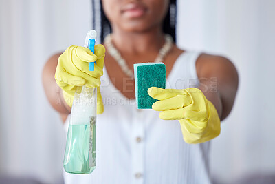 Buy stock photo Hands, spray bottle and sponge with a black woman cleaner in a home for housework, hygiene or cleaning. Gloves, spraying and equipment with a female maid in a house for domestic housekeeping