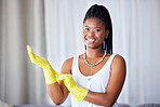 Cleaning, black woman and cleaner gloves portrait of a girl happy about home health care. House maintenance, smiling main and happiness from housekeeper service employee ready for housework chores