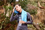 Fitness, sweat and man running on a mountain for exercise or training for a race or marathon. Sports, health and young male athlete or runner taking a break while doing a cardio workout in nature.