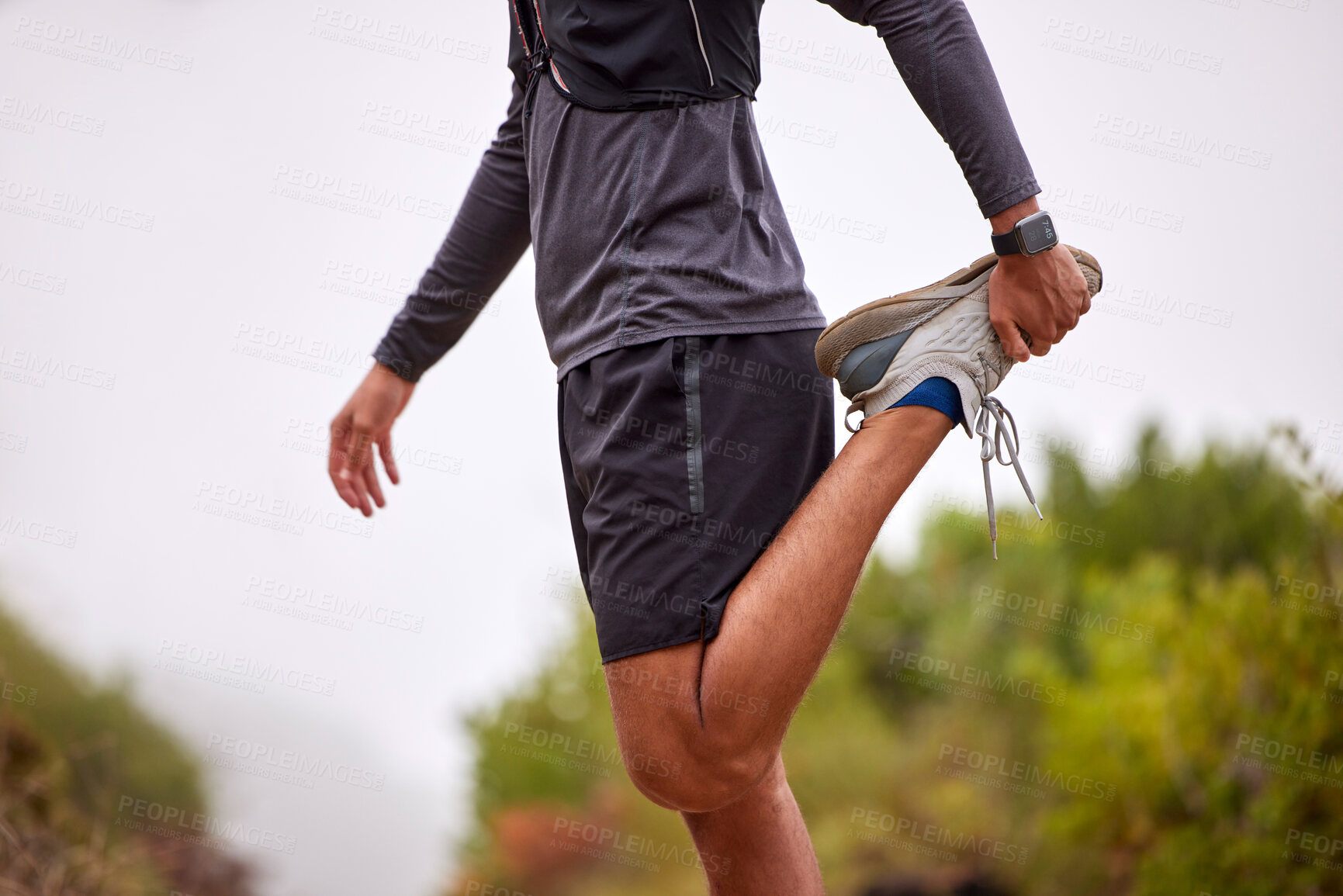 Buy stock photo Exercise, balance and man stretching legs on nature trail for running, marathon training and cardio workout. Sports, healthy body and torso of male athlete warm up for wellness, energy and fitness