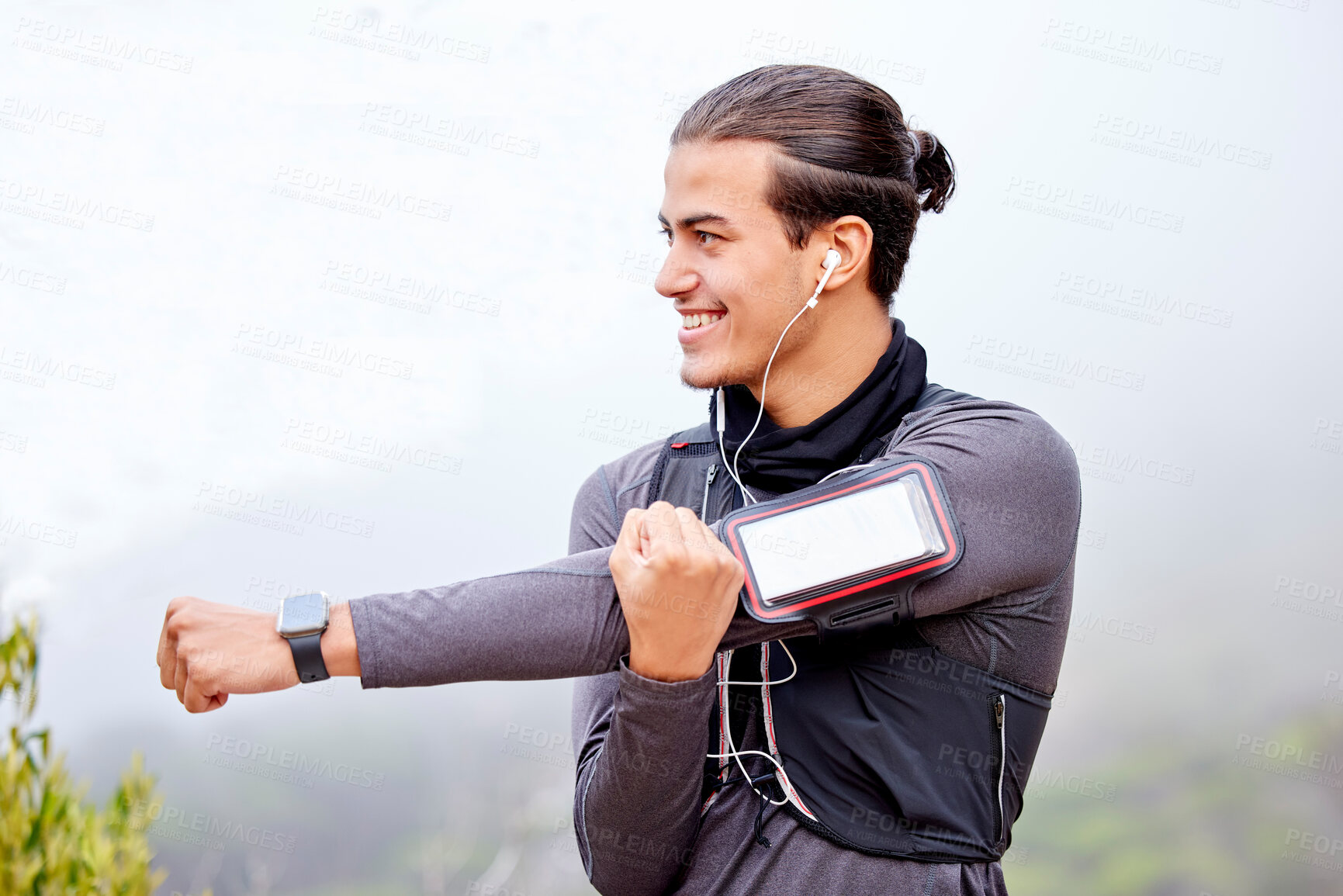 Buy stock photo Runner man, stretching arms and mountain with happiness, vision and phone for fitness, wellness or health. Athlete smile, smartphone and workout in nature, trees or happy for hiking, running or music