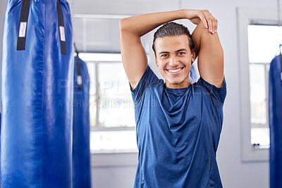 Buy stock photo Portrait, fitness and stretching with a boxing man in a gym getting ready for a workout for health. Exercise, smile and warm up with a happy male boxer training as a fighter in a performance center