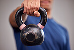 Fitness, kettlebell and man athlete in a gym for a arm muscle workout or sport training. Sports, weights and healthy male bodybuilder doing a strength exercise in a gymnasium or wellness studio.