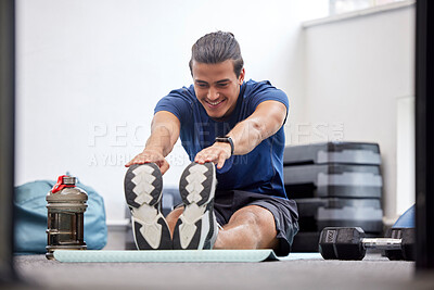 Buy stock photo Fitness, exercise or man stretching legs to start training, workout or warm up to relax muscles in body. Wellness, flexible or healthy sports athlete with a happy smile exercising in a gym in Brazil