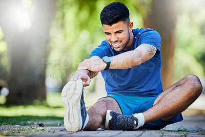 Buy stock photo Exercise, man on ground and stretching legs, workout and training for fitness, warm up and wellness outdoor. Relax, male athlete and runner stretch, sports and performance for endurance and energy