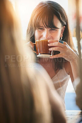 Buy stock photo Woman, friends and drinking coffee for conversation, chatting about social life or gossip at an outdoor cafe. Happy female smiling and enjoying a warm beverage, discussion or listening to best friend