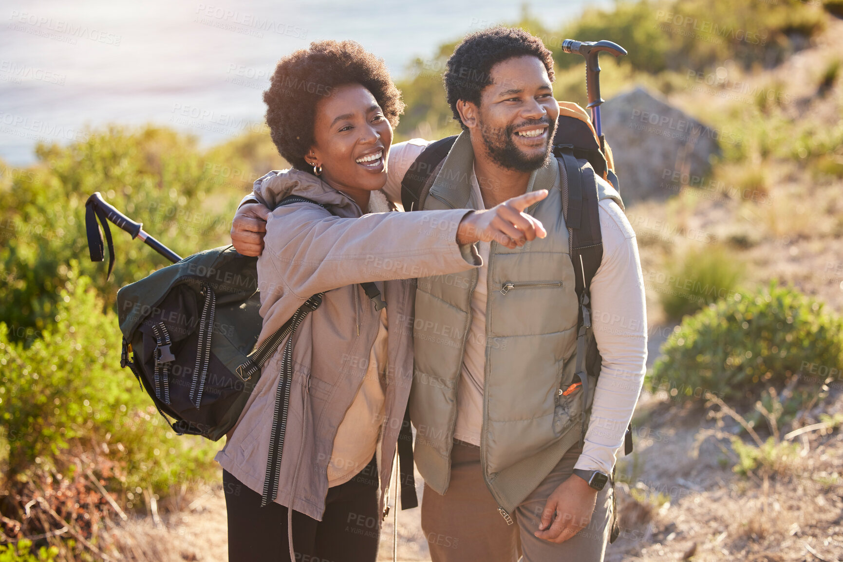 Buy stock photo Mountain, happy or black couple love hiking in nature for exercise, workout or training on summer holiday. Travel, woman and African partner pointing, trekking or walking to hill on outdoor adventure