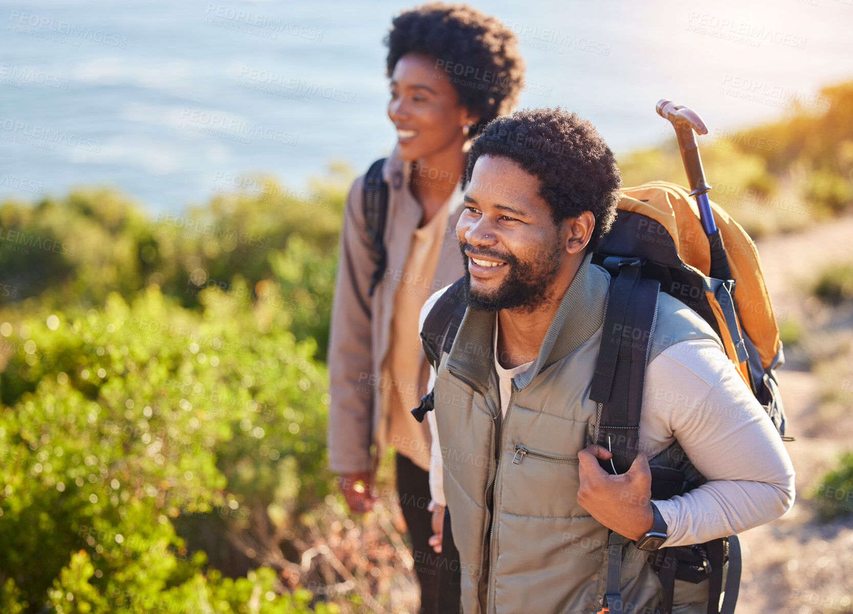 Buy stock photo Mountain, happy or couple of friends hiking in nature for exercise, workout or training on summer holiday. Travel, black woman and African partner trekking or walking to hill on outdoor adventure