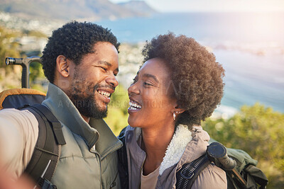 Buy stock photo Love, nature and selfie, couple hiking on mountain for fitness, fun and romantic walk in natural landscape. Romance, hiker man and black woman talking self portrait with smile in mountains on island.