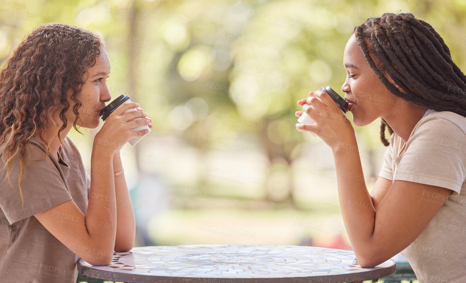 Buy stock photo Woman, friends and drinking coffee on table at cafe in social life, catchup or communication outside. Happy women enjoying friendly discussion, talk or drink together in friendship at restaurant shop