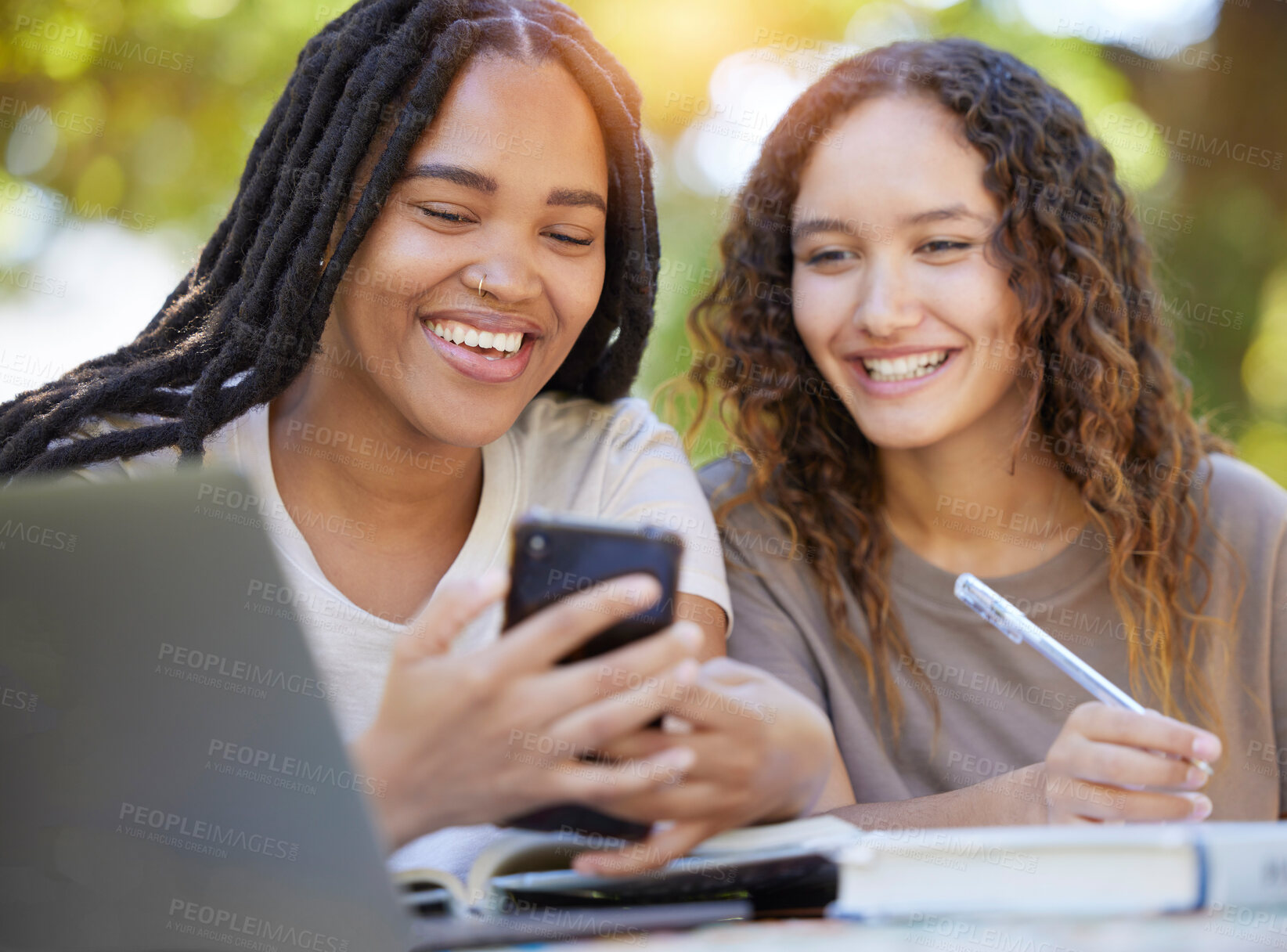 Buy stock photo Students, women and friends with phone at park laughing at funny meme. University scholarship, comic and happy girls or females with mobile smartphone laugh at joke or crazy comedy on social media.