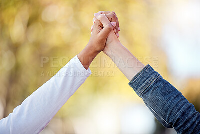 Buy stock photo Support, love and friends holding hands in the city for community, freedom and trust in Singapore. Care, collaboration and people with solidarity, romantic gesture and compassion together in town