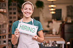 Woman, small business owner and hiring sign with smile for recruitment, job or startup at pottery store. Portrait of happy CEO manager holding board for hire, opportunity or recruiting at retail shop