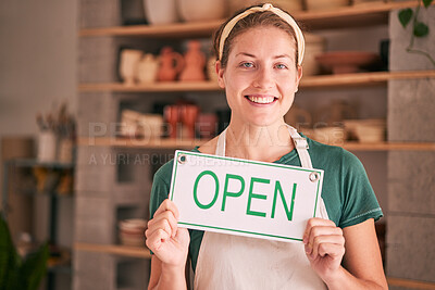 Buy stock photo Woman, small business and open sign for creative startup, welcome or entrepreneurship at retail store. Portrait of happy owner in pottery shop with smile holding opening board in ready for service