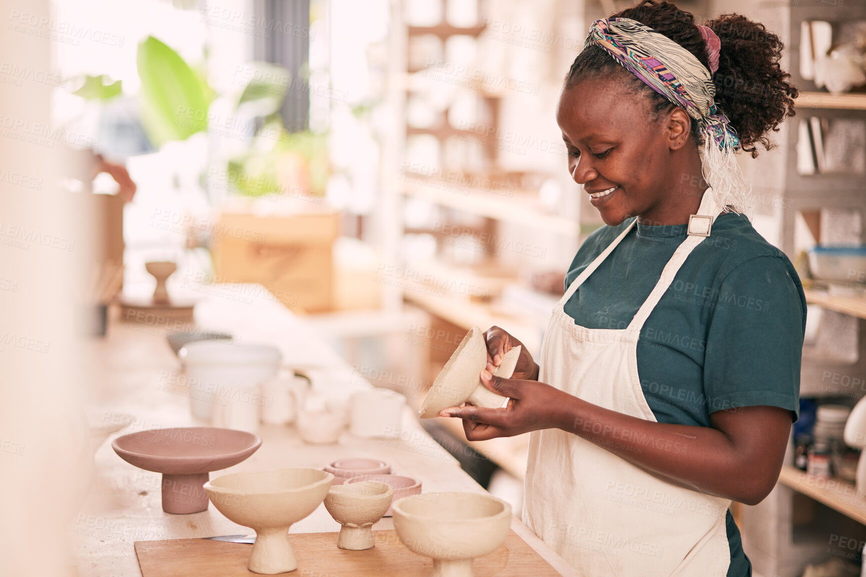 Buy stock photo Ceramic store, creative pottery and black woman working on sculpture design mold, manufacturing or art product. Creativity, molding and startup small business owner, worker or girl in studio workshop
