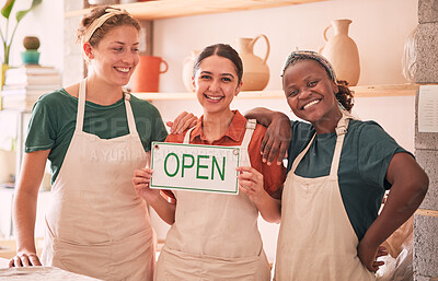 Buy stock photo Small business, partnership and women with open sign for pottery startup, creative workshop and art studio. Smile, teamwork and owners happy for welcome to ceramics, clay sculpture and artwork store