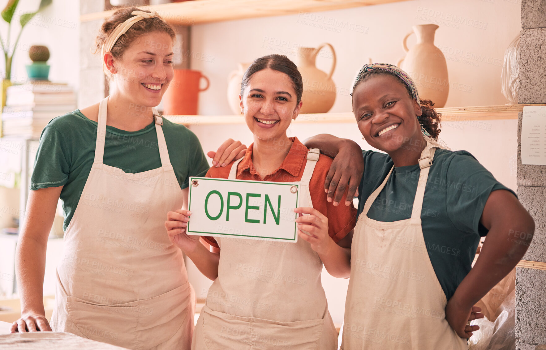 Buy stock photo Small business, partnership and women with open sign for pottery startup, creative workshop and art studio. Smile, teamwork and owners happy for welcome to ceramics, clay sculpture and artwork store