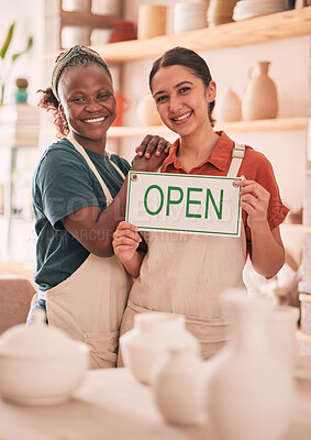 Buy stock photo Open sign, collaboration and women with small business for pottery startup, creative workshop and art studio. Retail, welcome and happy females smile for ceramics, clay sculpture and artwork store